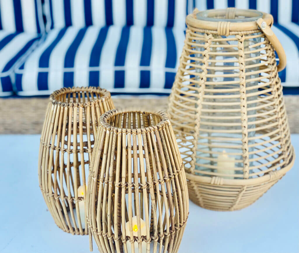three wood lanterns outdoors